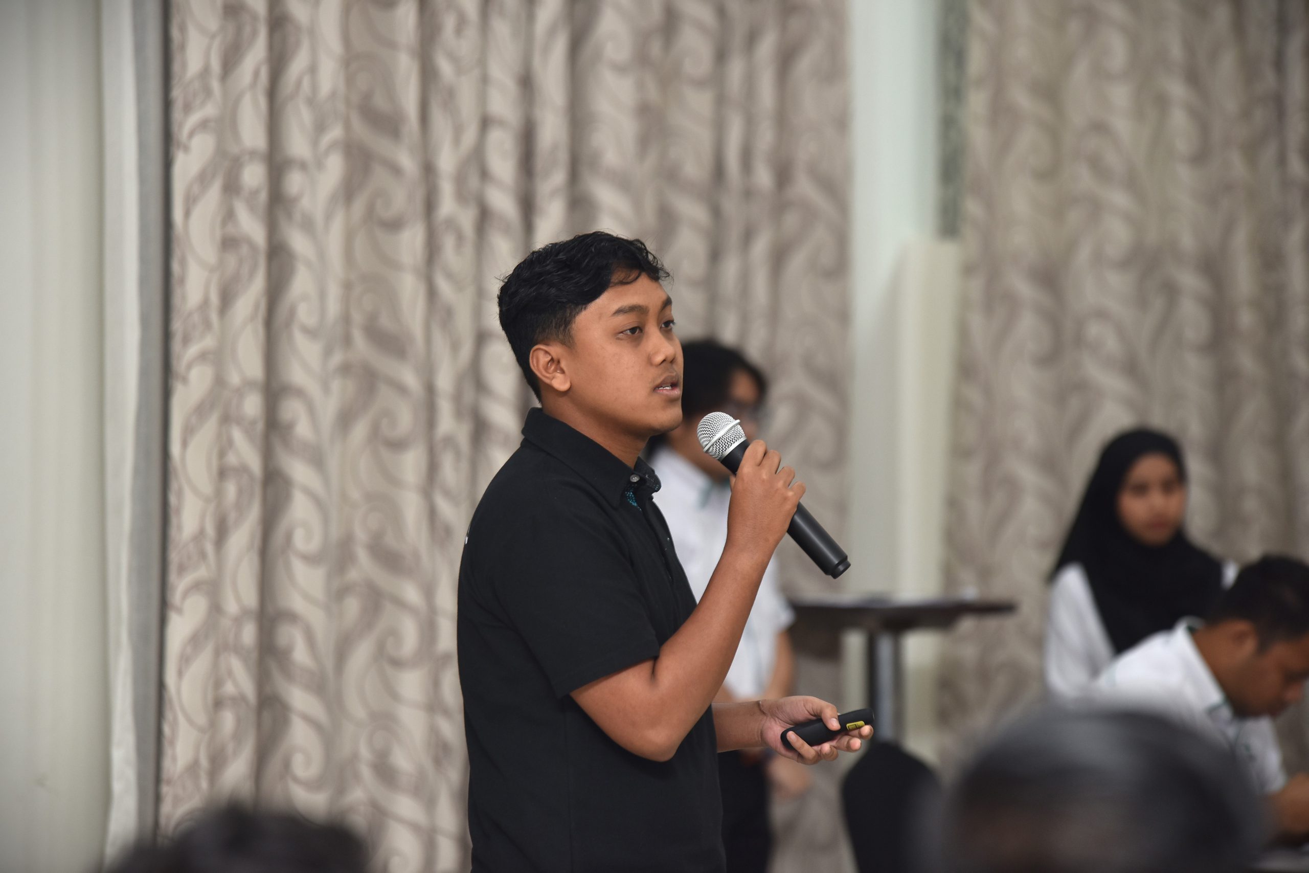 Students attending the opening ceremony programme.