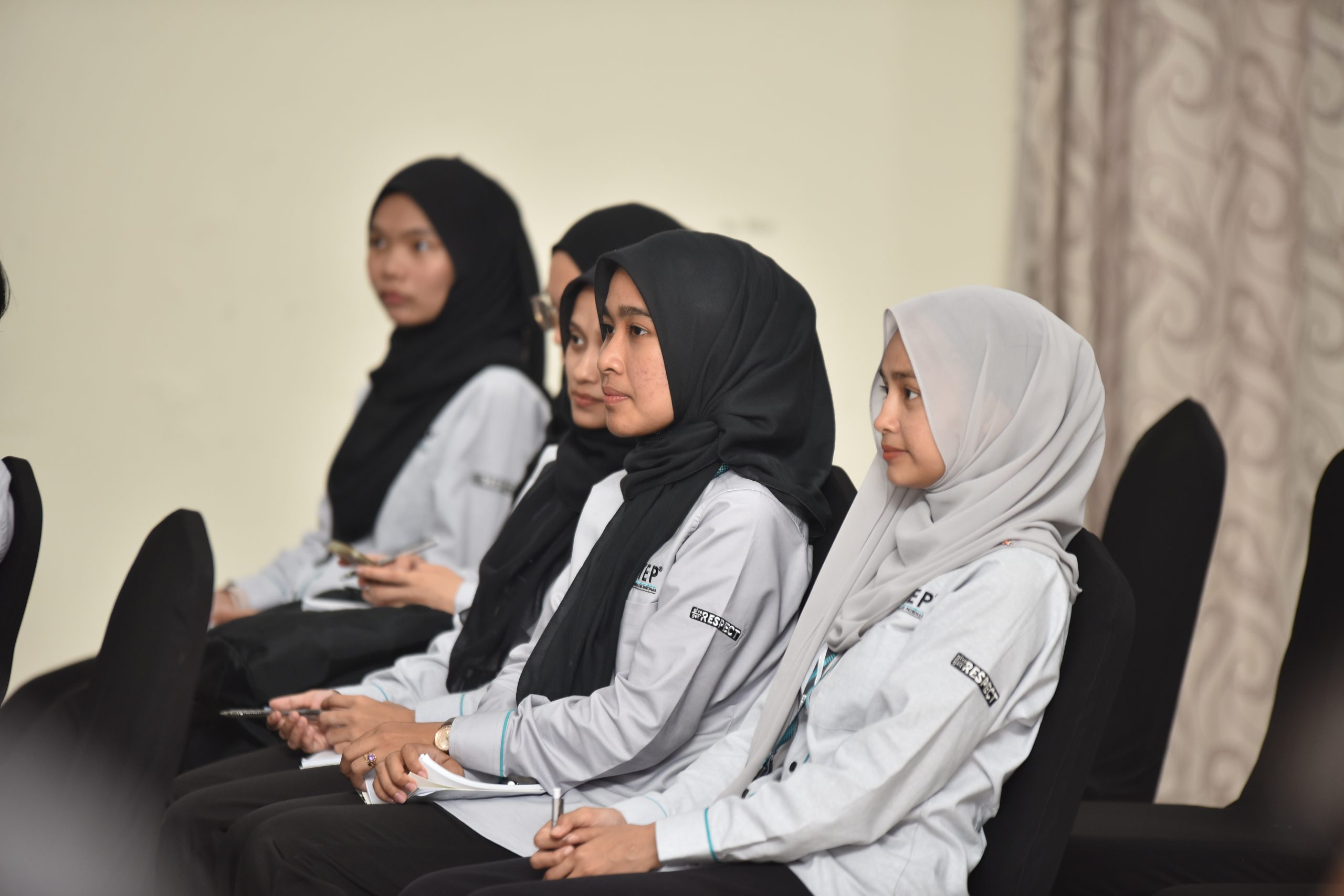 Students attending the opening ceremony programme.